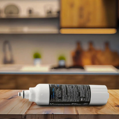 Kenmore Elite 46-9490 Refrigerator Water Filter lying on a wooden kitchen countertop with blurred background cabinets.