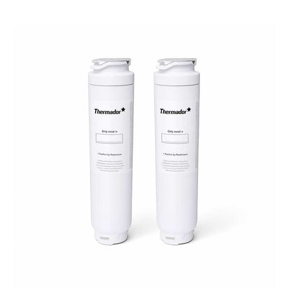Two Thermador refrigerator replacement water filters standing upright on white background for improved water quality